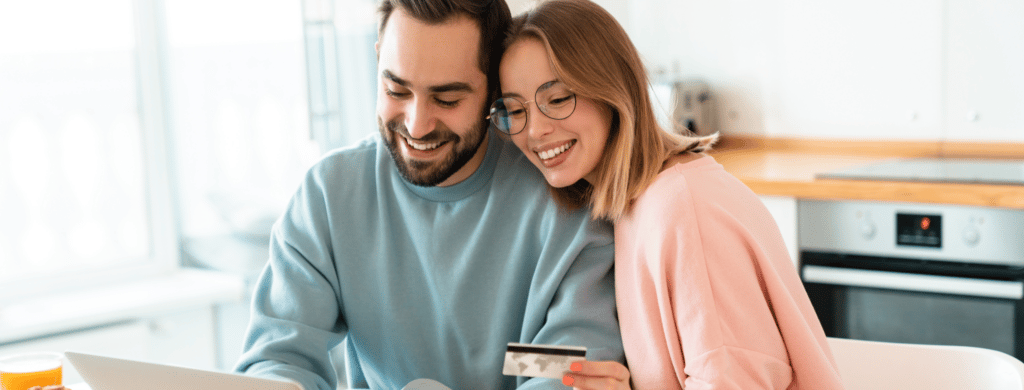 Couple paying off credit card and beginning a life of debt free living