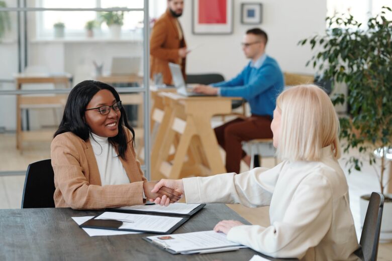 cheerful female applicant and her new employer sha 2021 09 24 03 45 34 utc min