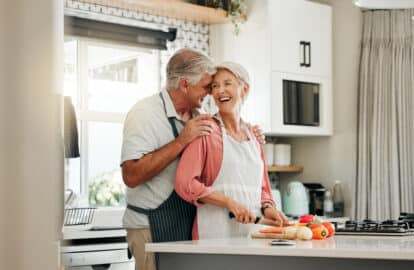 senior couple in kitchen cooking healthy food tog 2022 12 10 00 22 08 utc (1)