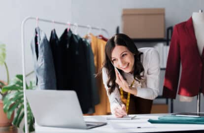 ecommerce, small business and phone call, woman with tablet taking sales orders and checking inventory. customer service on smartphone, online shopping success and girl boss, contact us for delivery.